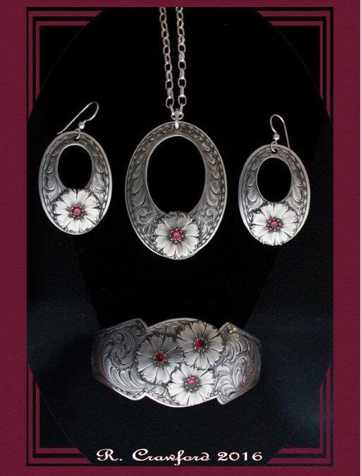 14. Rex Crawford, Wild Daisy Necklace,  Earrings and Bracelet, sterling silver and ruby gemstones, $1,750