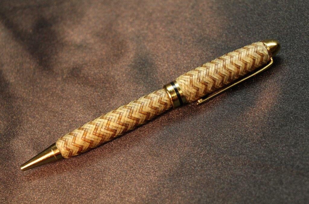 29. Whit Olson, Braided Rawhide Pen, 36 plait with Walnut interweaves. Includes wood presentation case, $350