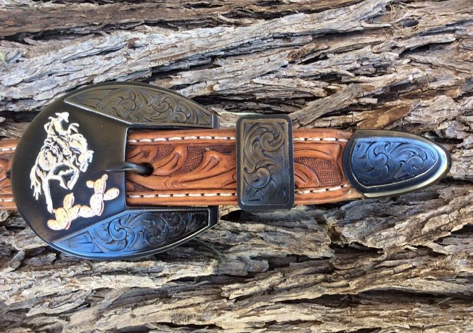 Mike Pardue, Three Piece Buckle Set, engraved steel overlay, sterling bronc and copper cactus overlays, caustic blue finish