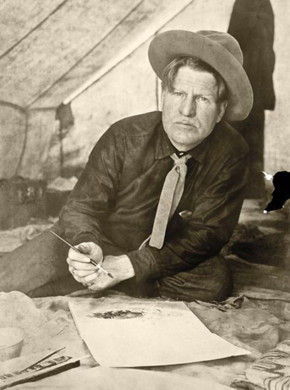 Charlie Russell painting in a tent