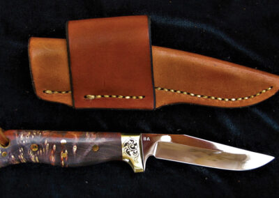 Knife with orange and black Maple burl handle by Brian Asher